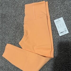 NWT ATHLETA Ultra High Rise Elation 7/8 tight Size Small  Orange ish Peach